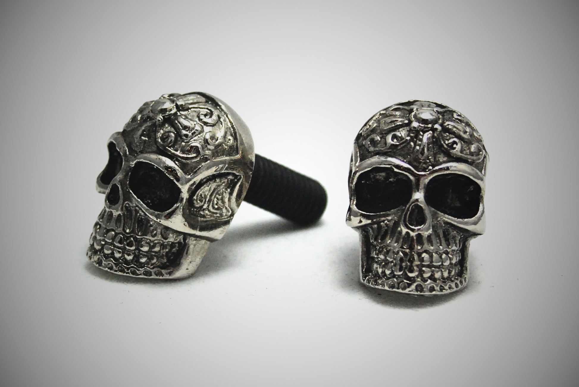 Tribal skull motorcycle bolts pair front view