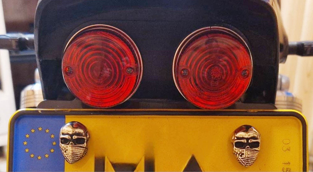 Skull Bandana bolt displayed on hand – size comparison