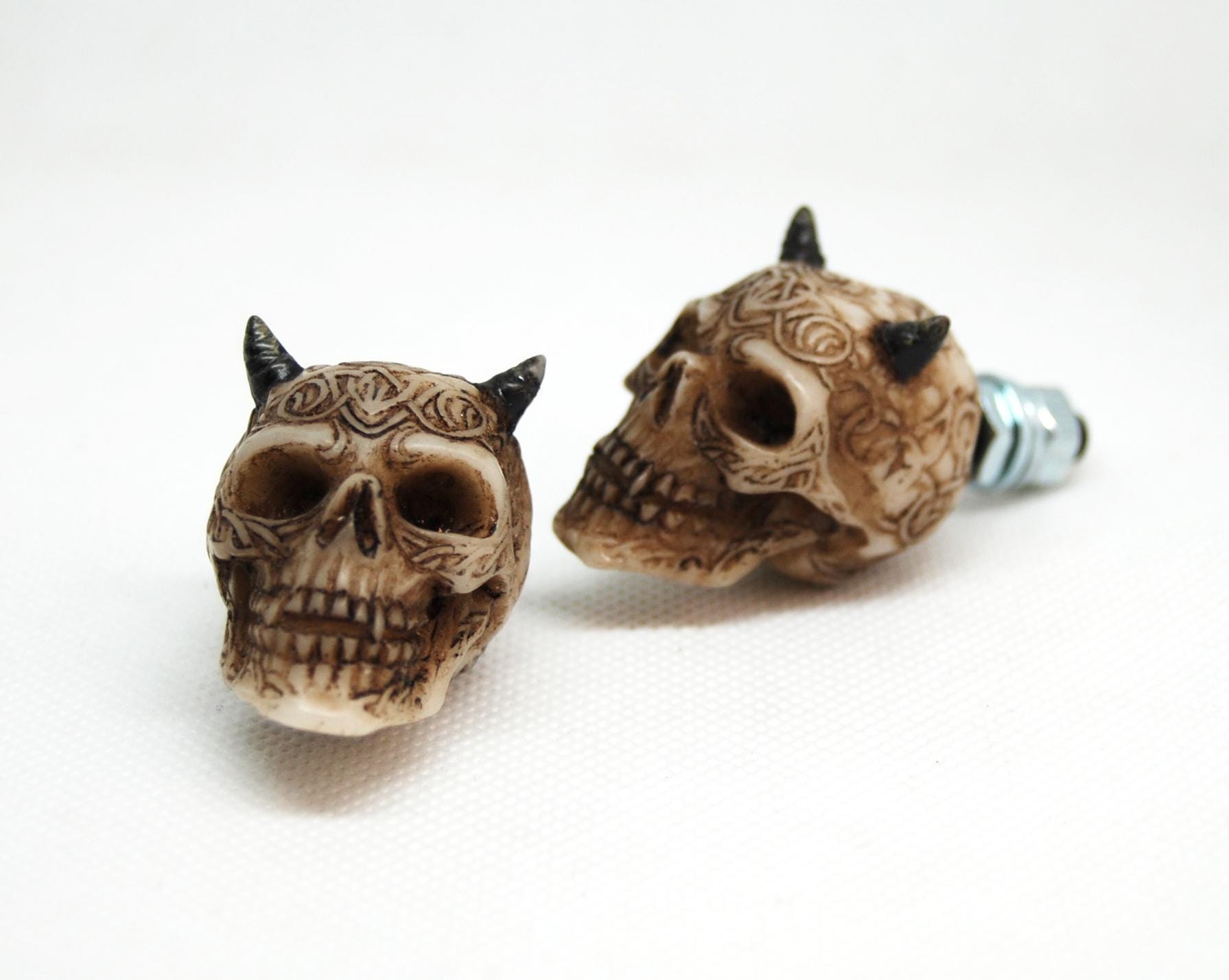 Custom motorcycle skull bolts close-up
